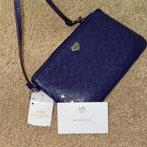 COACH navy liquid gloss medium wristlet